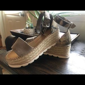 Flatform suede and snakeskin sandals.